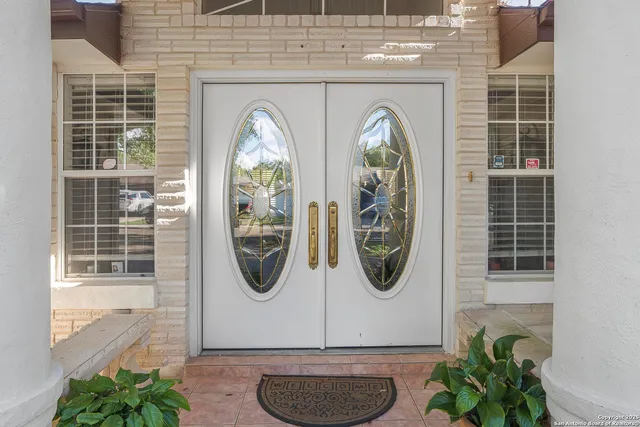 a front view of a house with large windows