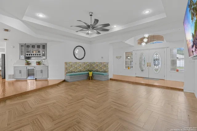 a view of kitchen with granite countertop cabinets stainless steel appliances and a dining table