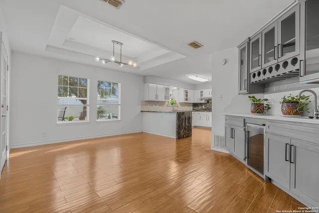 a view of a kitchen with microwave and cabinets