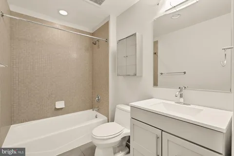 a bathroom with a sink a toilet and a bathtub