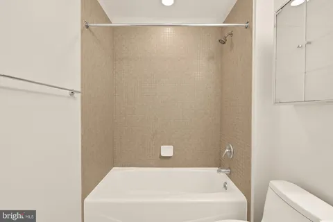 a bathroom with a white bath tub