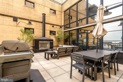 a view of a patio with couches and potted plants