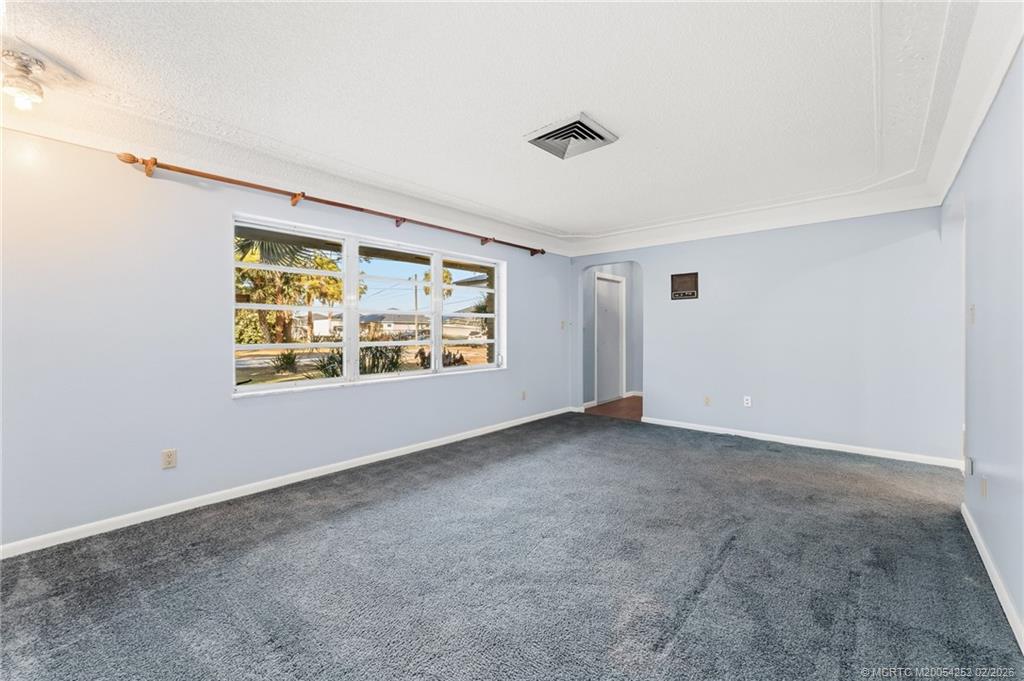 1201 Oak Avenue Fort Pierce, FL 34982 - Photo 13 of 43 an empty room with windows