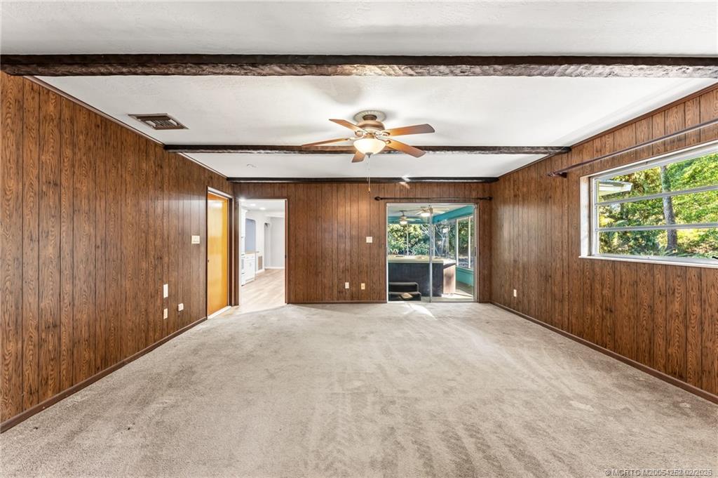 1201 Oak Avenue Fort Pierce, FL 34982 - Photo 15 of 43 an empty room with windows and chandelier