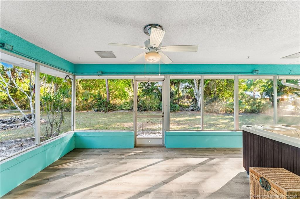 1201 Oak Avenue Fort Pierce, FL 34982 - Photo 19 of 43 a view of a large room with large windows and plants