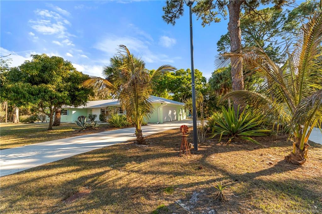 1201 Oak Avenue Fort Pierce, FL 34982 - Photo 2 of 43 a view of a trees in front of a house