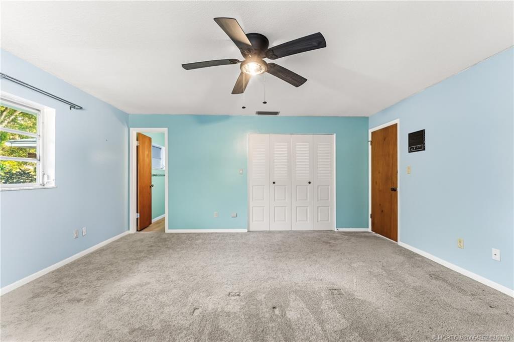 1201 Oak Avenue Fort Pierce, FL 34982 - Photo 22 of 43 a view of an empty room with a ceiling fan