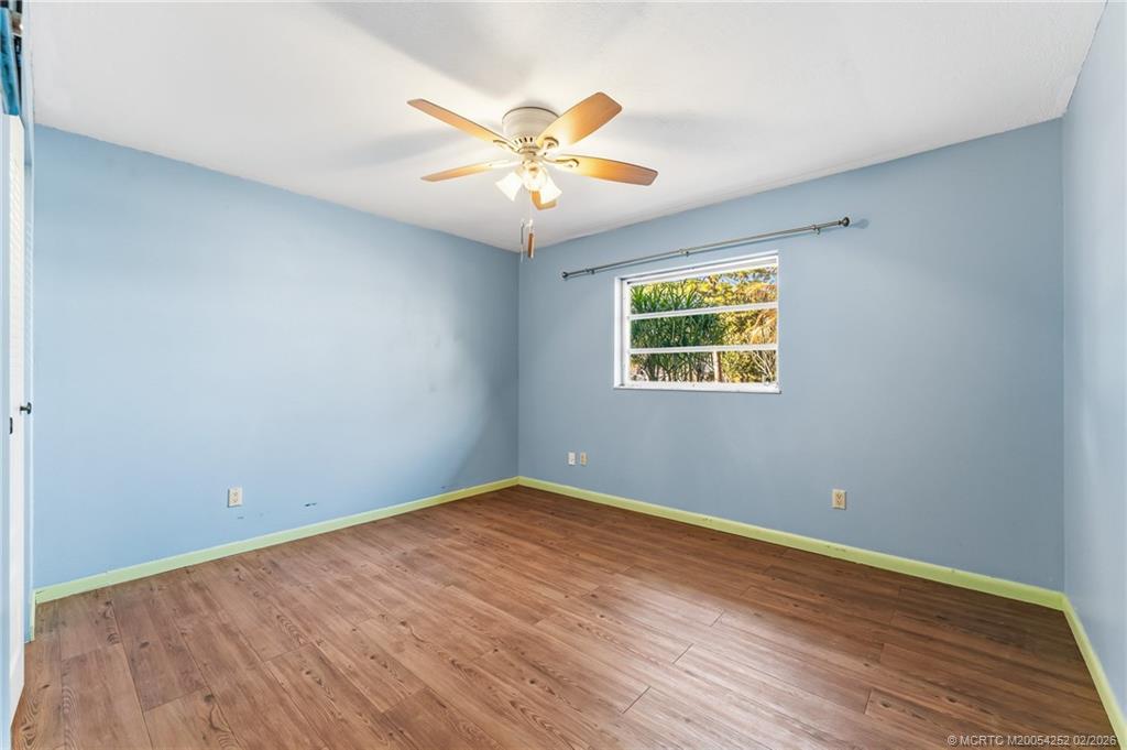 1201 Oak Avenue Fort Pierce, FL 34982 - Photo 25 of 43 wooden floor in an empty room with a window