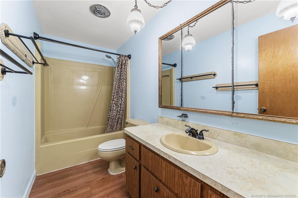 1201 Oak Avenue Fort Pierce, FL 34982 - Photo 26 of 43 a bathroom with a granite countertop sink toilet and shower