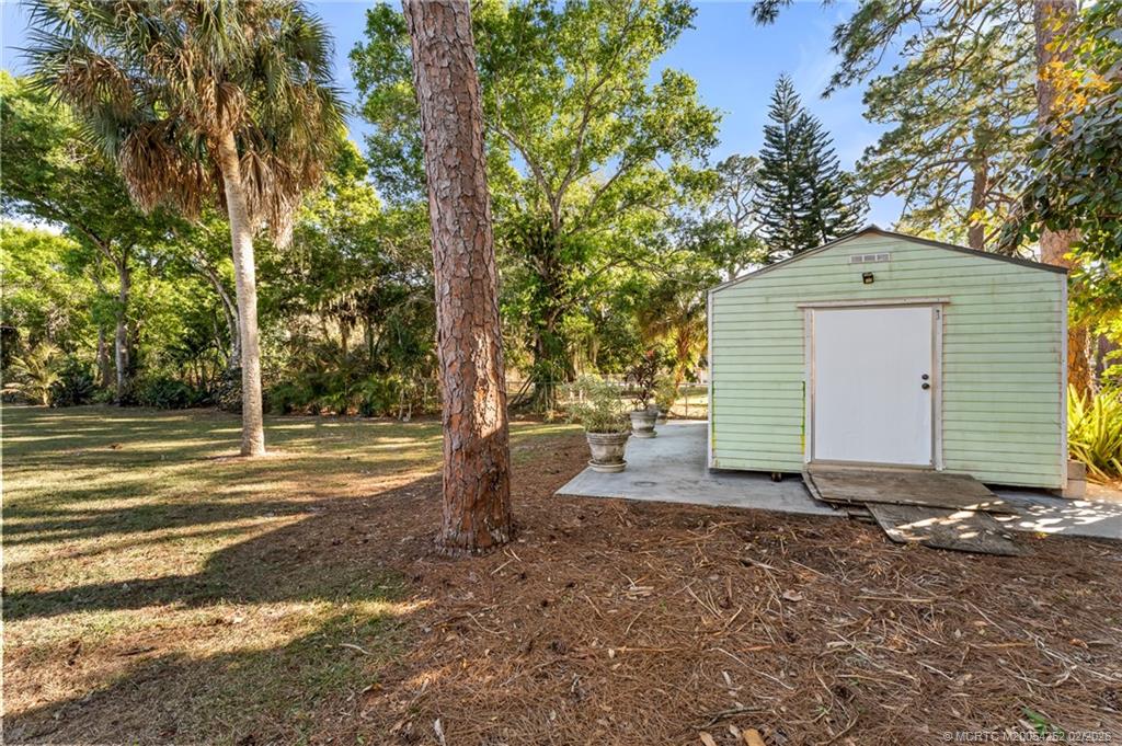 1201 Oak Avenue Fort Pierce, FL 34982 - Photo 30 of 43 a view of a house with backyard and trees