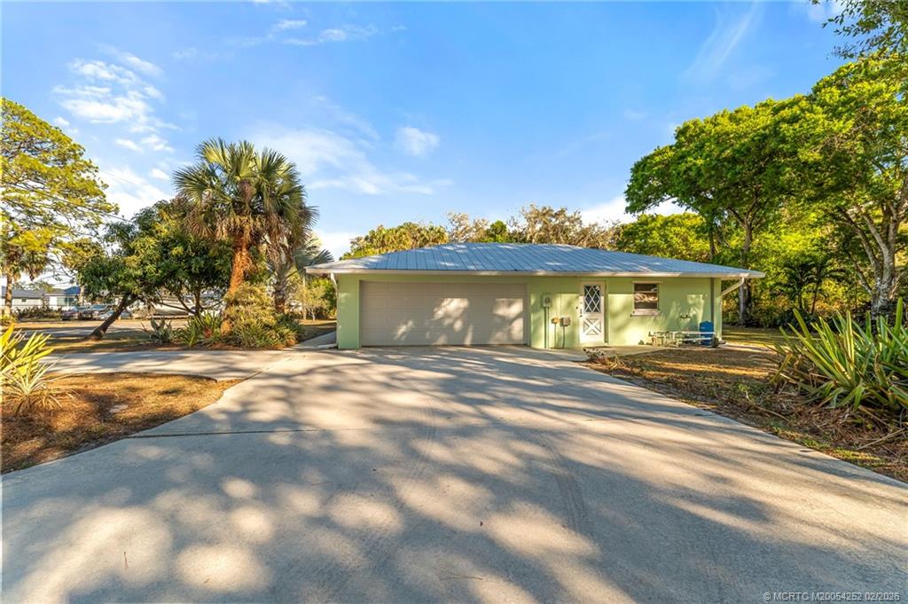 1201 Oak Avenue Fort Pierce, FL 34982 - Photo 3 of 43 a view of a house with a yard next to a yard