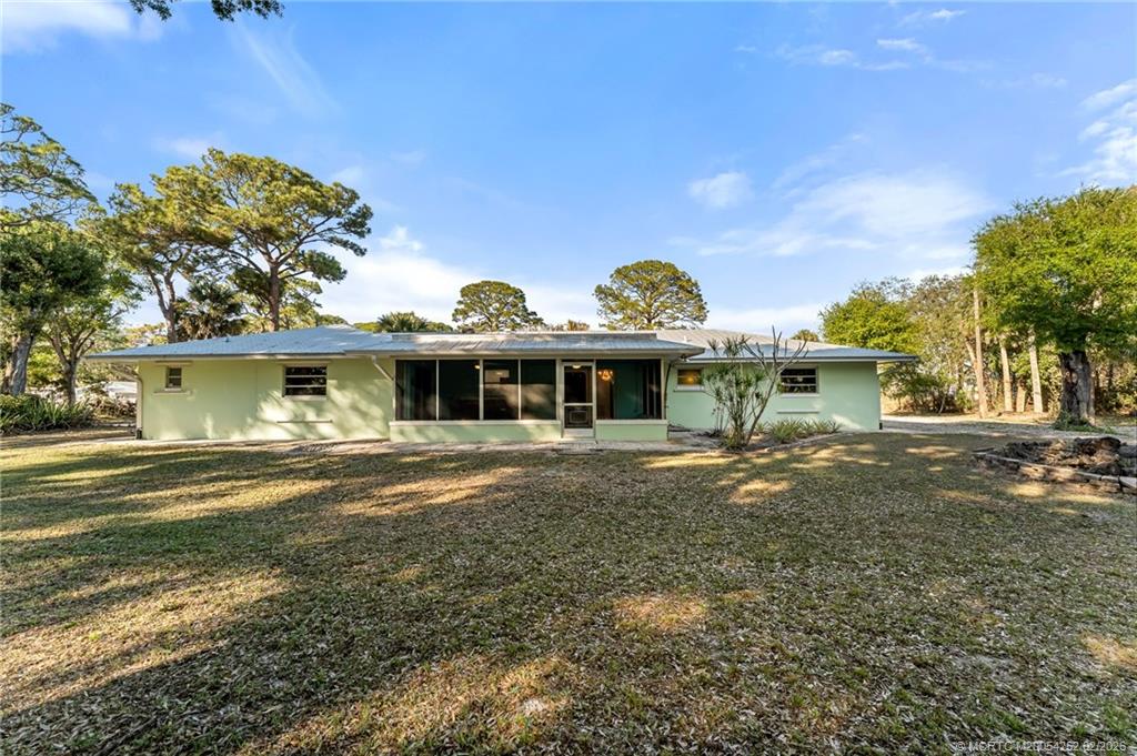 1201 Oak Avenue Fort Pierce, FL 34982 - Photo 38 of 43 a front view of a house with a yard