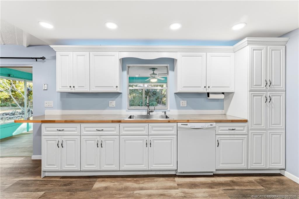1201 Oak Avenue Fort Pierce, FL 34982 - Photo 9 of 43 a kitchen with white cabinets and sink