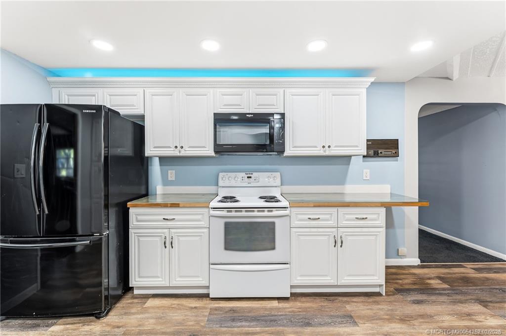 1201 Oak Avenue Fort Pierce, FL 34982 - Photo 10 of 43 a kitchen with a stove top oven and refrigerator