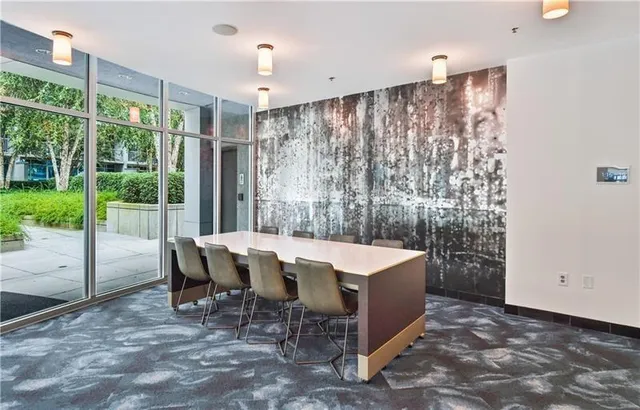 a dining room with a table and chairs