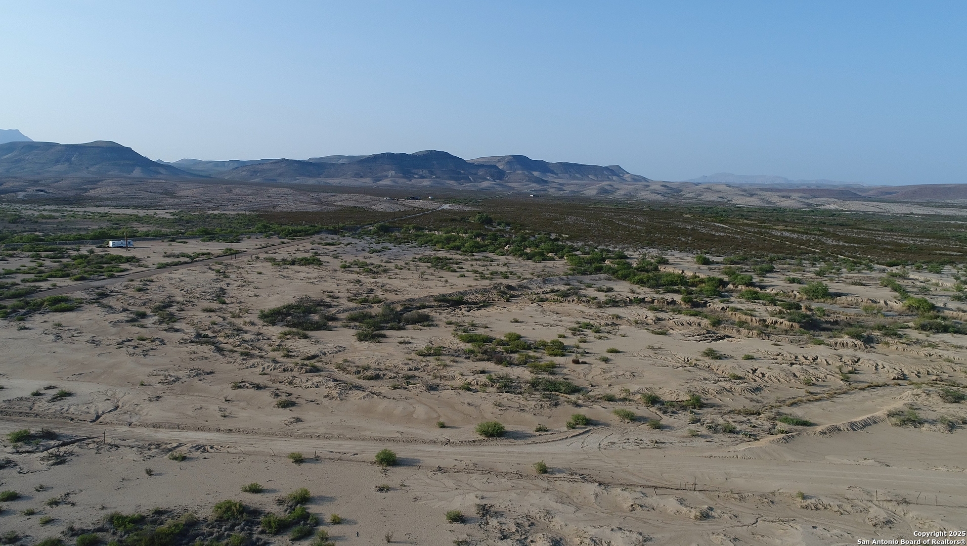 0 Ivy Road Alpine, TX 79830 - Photo 15 of 50 a view of a dry field with mountains in the background