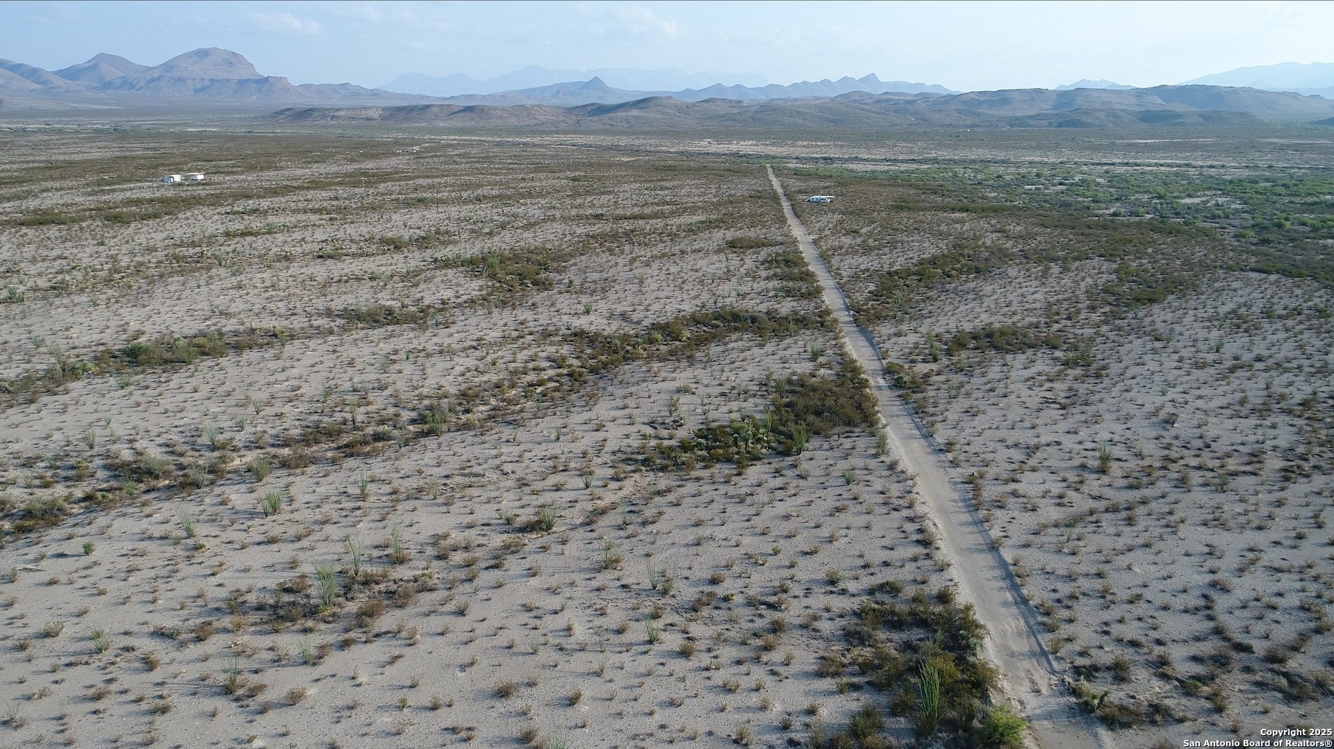 0 Ivy Road Alpine, TX 79830 - Photo 2 of 50 a view of a dry yard with wooden floor and a mountain view