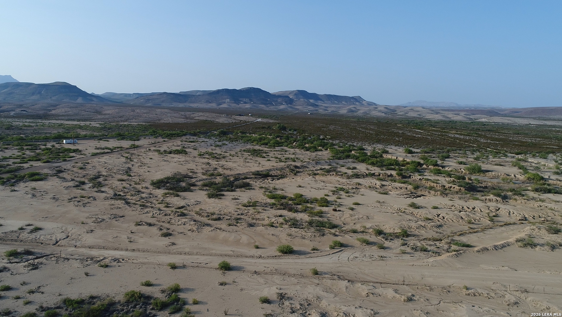 0 Ivy Road Alpine, TX 79830 - Photo 3 of 50 a view of a dry field with mountains in the background
