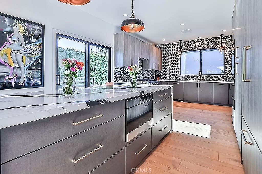 19532 Bermuda Street Porter Ranch, CA 91326 - Photo 13 of 74 a kitchen with stainless steel appliances granite countertop a stove a sink and a microwave