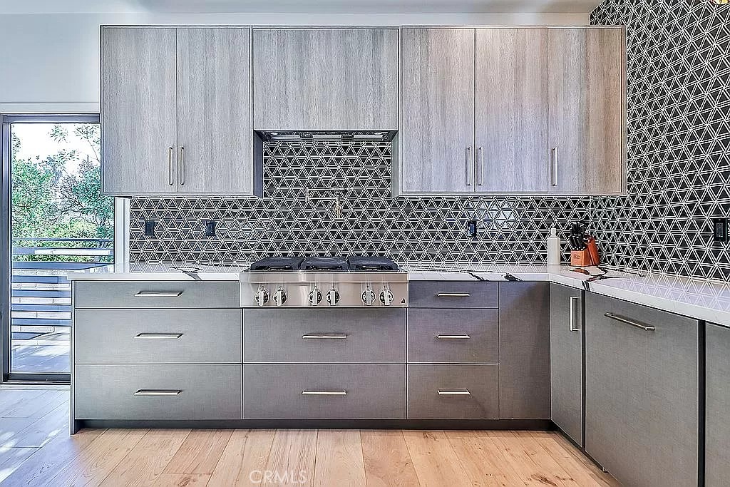 19532 Bermuda Street Porter Ranch, CA 91326 - Photo 15 of 74 a kitchen with a sink and cabinets