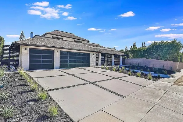 a house view with a backyard space