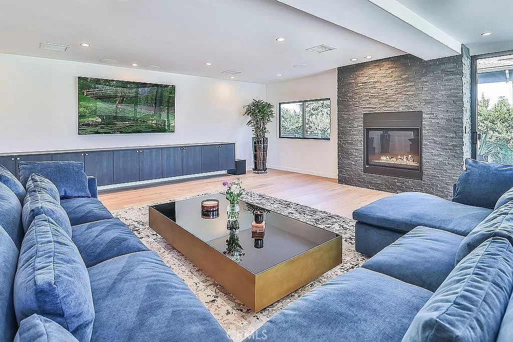 19532 Bermuda Street Porter Ranch, CA 91326 - Photo 23 of 74 a living room with furniture and a large window