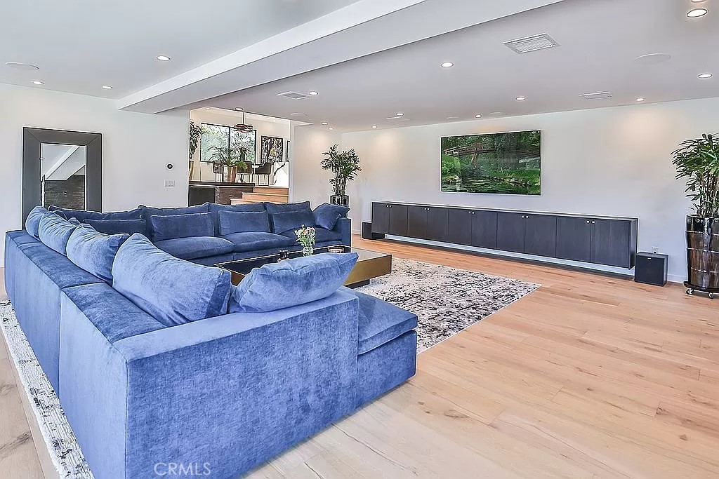 19532 Bermuda Street Porter Ranch, CA 91326 - Photo 25 of 74 a living room with furniture and a flat screen tv