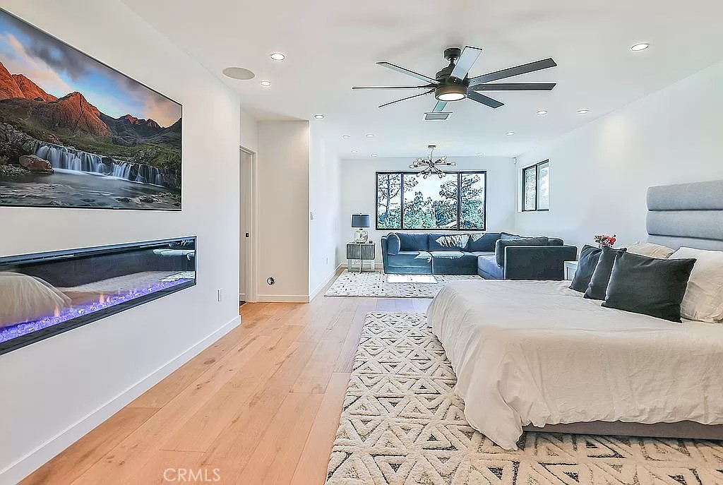 19532 Bermuda Street Porter Ranch, CA 91326 - Photo 27 of 74 a large bedroom with a bed and glass walk in closet
