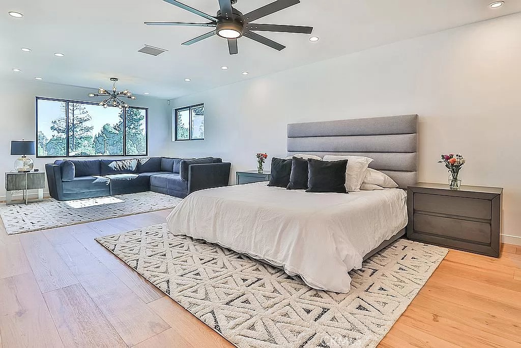 19532 Bermuda Street Porter Ranch, CA 91326 - Photo 28 of 74 a bedroom with a large bed and a couch