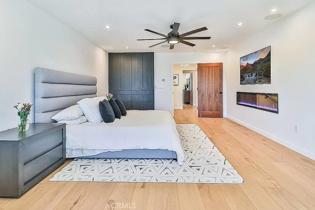19532 Bermuda Street Porter Ranch, CA 91326 - Photo 29 of 74 a bedroom with a bed rug and wall painting