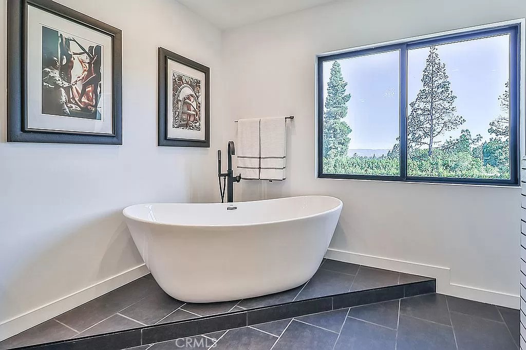 19532 Bermuda Street Porter Ranch, CA 91326 - Photo 35 of 74 a white bath tub sitting next to a window