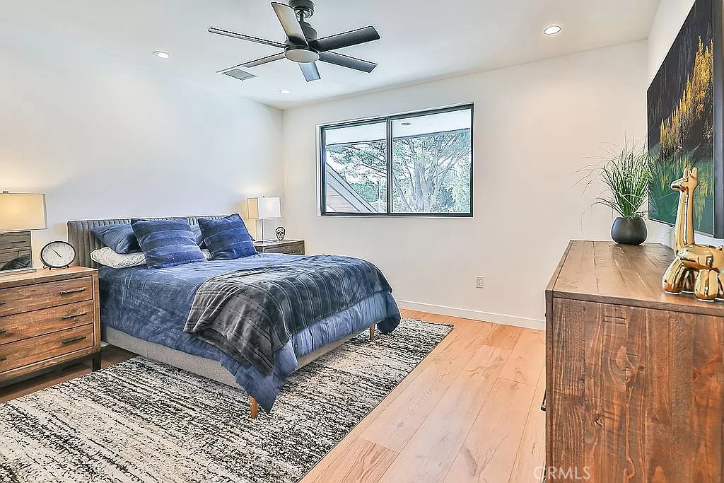 19532 Bermuda Street Porter Ranch, CA 91326 - Photo 38 of 74 a bedroom with a large bed and a window