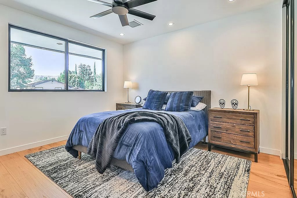 19532 Bermuda Street Porter Ranch, CA 91326 - Photo 43 of 74 a bedroom with a bed and a painting on the wall
