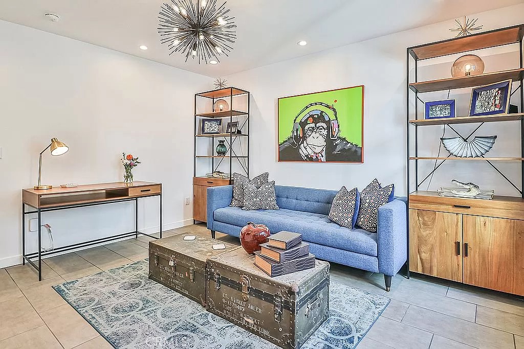 19532 Bermuda Street Porter Ranch, CA 91326 - Photo 47 of 74 a living room with furniture and a dining table