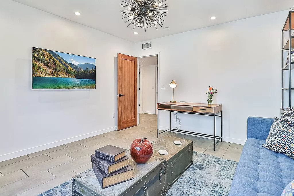 19532 Bermuda Street Porter Ranch, CA 91326 - Photo 48 of 74 a living room with furniture and a potted plant