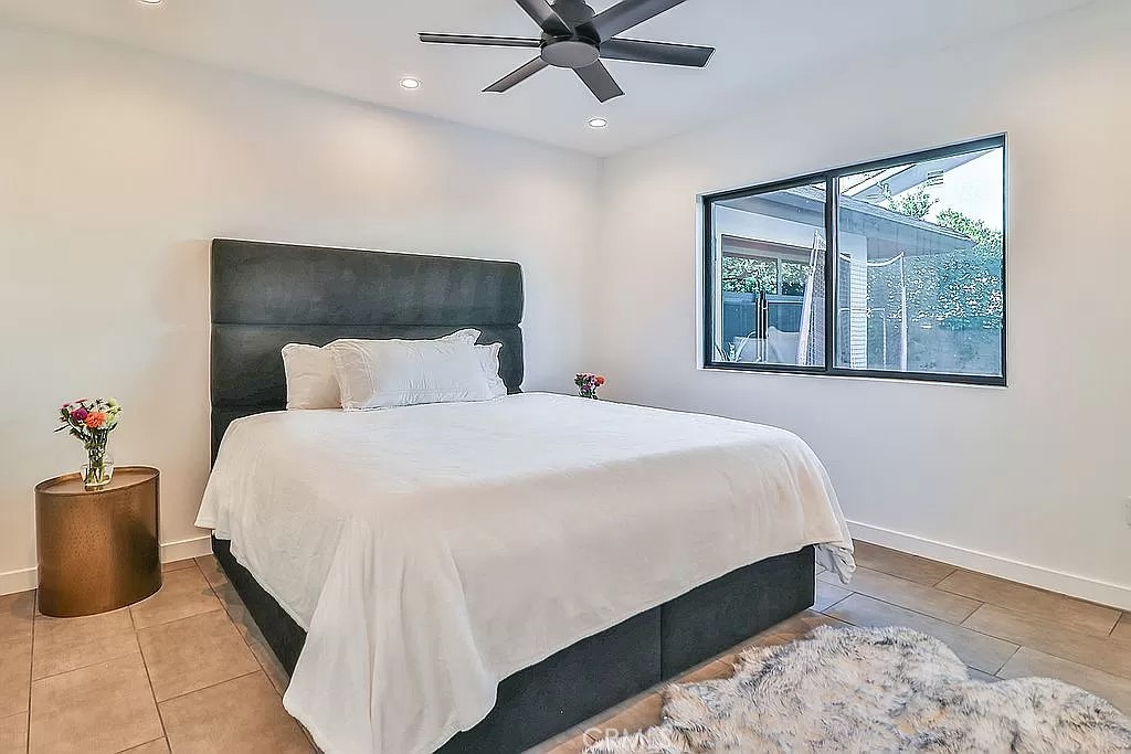 19532 Bermuda Street Porter Ranch, CA 91326 - Photo 49 of 74 a bedroom with a bed and window