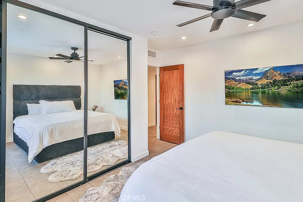 19532 Bermuda Street Porter Ranch, CA 91326 - Photo 50 of 74 a bedroom with a bed and a painting on the wall