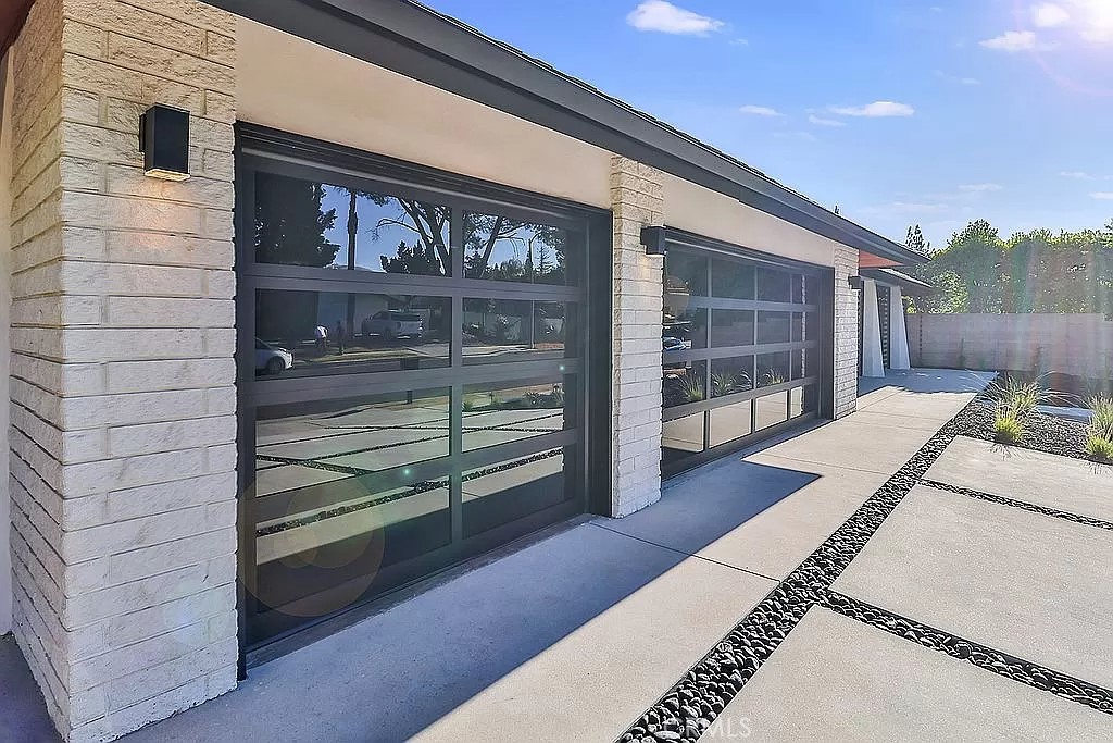 19532 Bermuda Street Porter Ranch, CA 91326 - Photo 5 of 74 a view of a house with a balcony and door