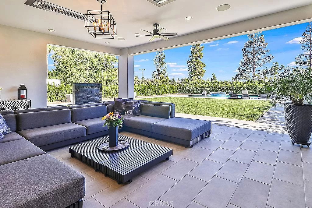 19532 Bermuda Street Porter Ranch, CA 91326 - Photo 58 of 74 a living room with furniture and a floor to ceiling window