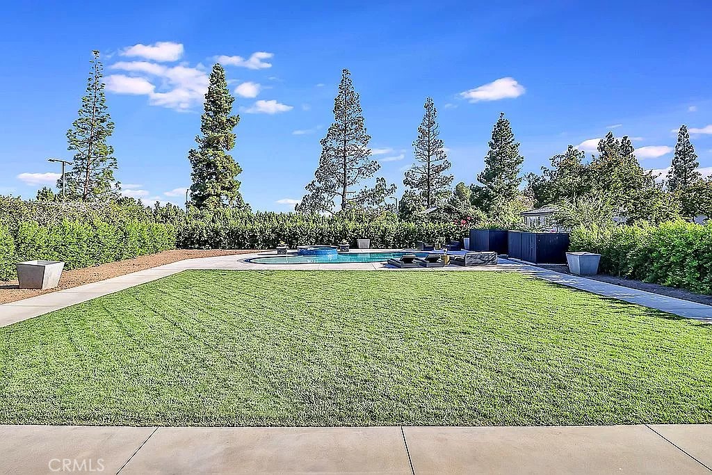 19532 Bermuda Street Porter Ranch, CA 91326 - Photo 65 of 74 a view of a swimming pool with a yard