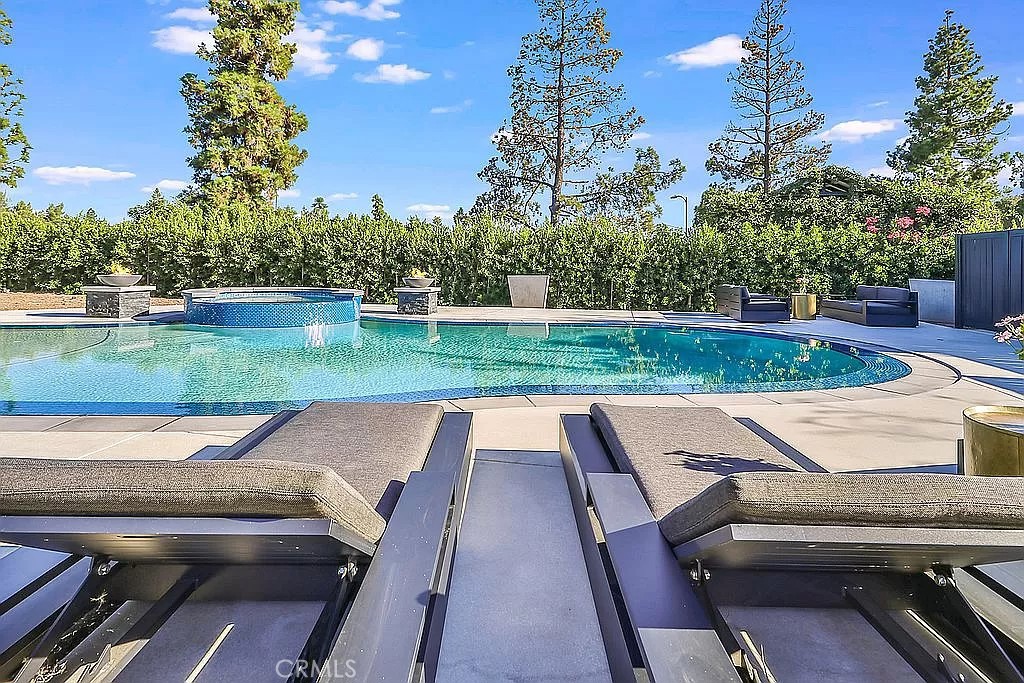 19532 Bermuda Street Porter Ranch, CA 91326 - Photo 67 of 74 a view of yard with swimming pool and outdoor seating