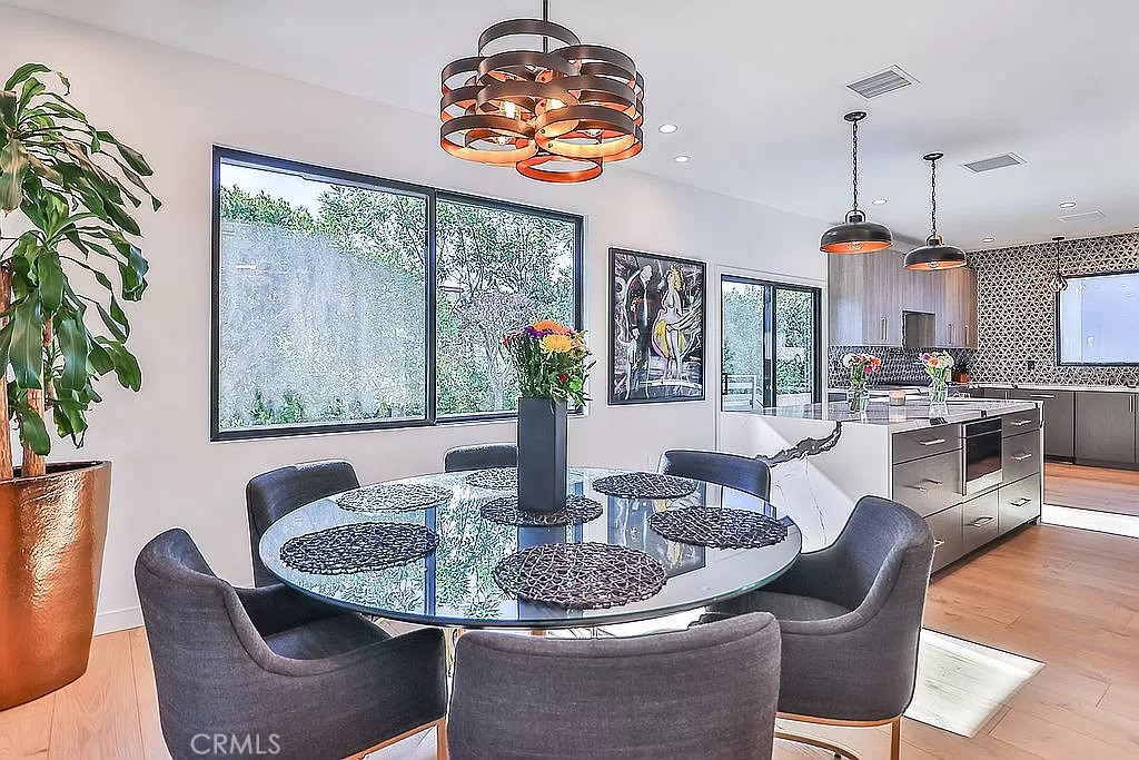 19532 Bermuda Street Porter Ranch, CA 91326 - Photo 10 of 74 a dining room with furniture a large window and dining table