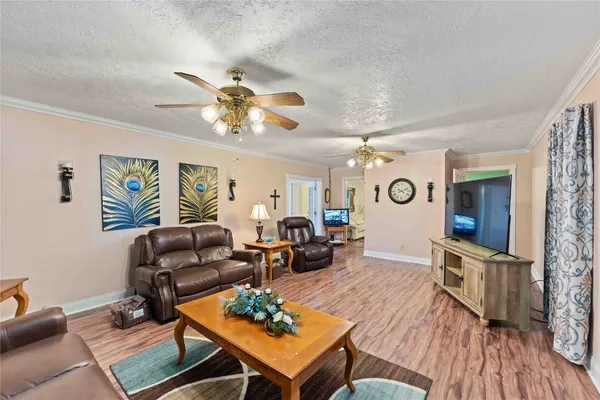 a living room with furniture fireplace and a flat screen tv