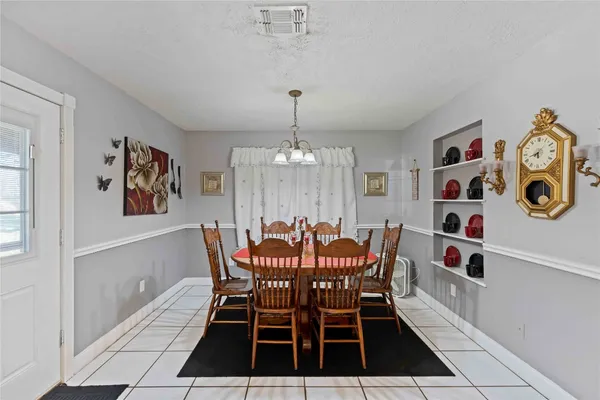 a dining room with furniture and window