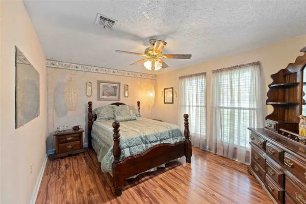 a bed room with bed and window