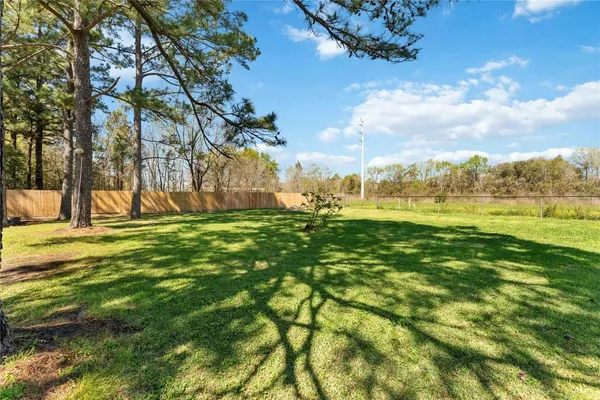 a view of outdoor space with deck and yard