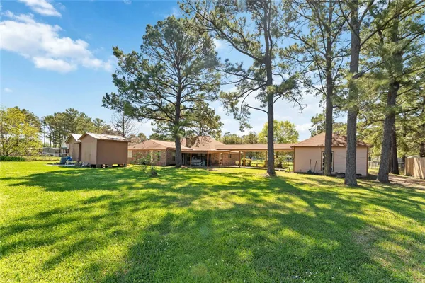 a view of a house with a yard patio and a patio