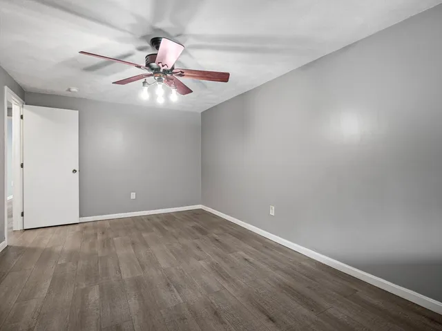a view of a livingroom with a fireplace and a window