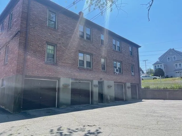 a view of a brick building with many windows