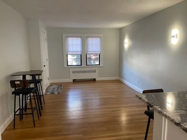 a view of livingroom and hardwood floor